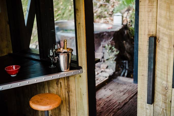 humble bee cosy cabin honeyside down oakhampton devon england uk glamping interior kitchen and doorway to outdoor bath tub
