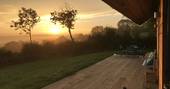 Beautiful views of the Devon countryside in the early morning mist from the decking at The Nap cabin