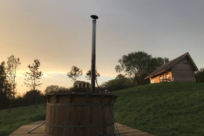 Relax and unwind in the wood fired hot tub at The Nap cabin in Devon
