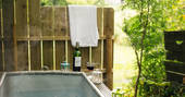Outdoor hot tub and red wine outside of Penn Bergeyn in Devon