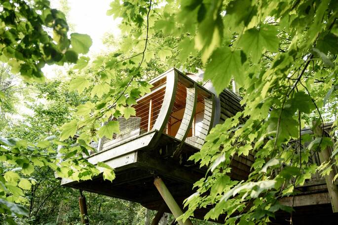 Seating area on the deck at Hideaway Treehouse at Pickwell Manor in Devon