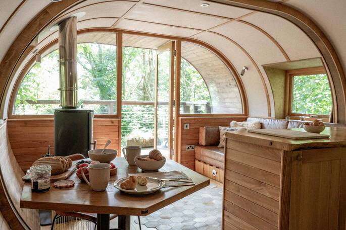 View out from the living room of the surrounding woodland at The Hideaway at Pickwell treehouse in Devon