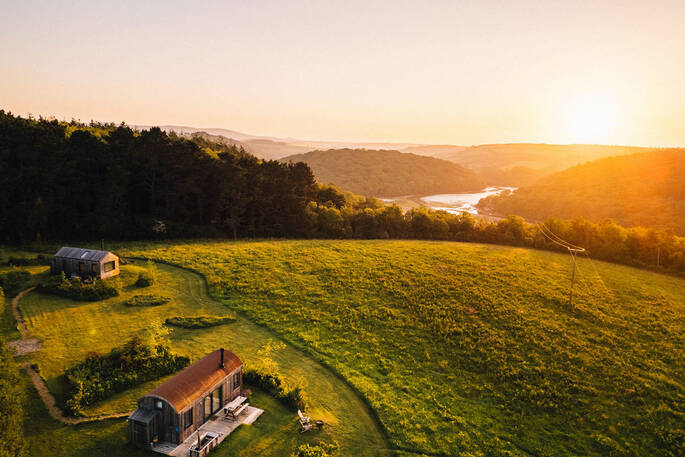 Two cabins at sunset