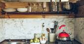 13 - Kitchen equipped with a single ring gas hob, kettle and cooking utensils