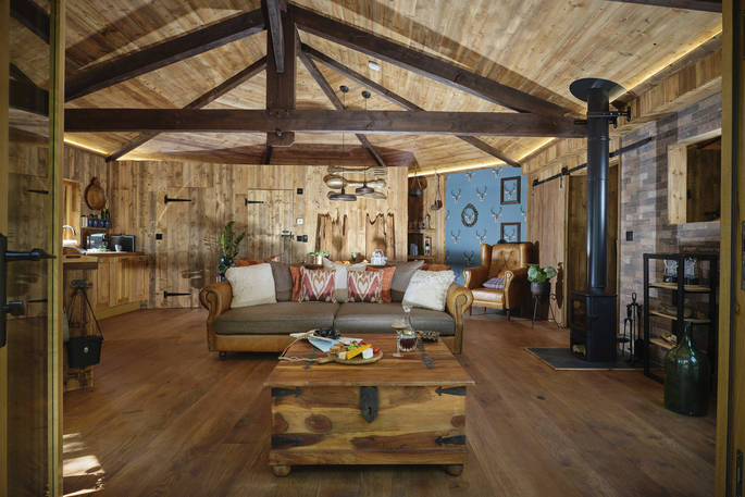 Hideout Treehouse interior with wood burner, Hartland, Devon