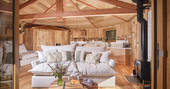 Nest Treehouse interior with wood burner, Hartland, Devon
