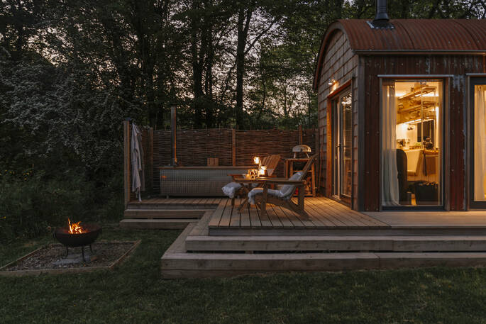 The Withywindle cabin decking at night, Poughill, Crediton, Devon, England