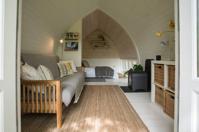 A view of the whole interior space with bedroom and living space, at Fleur's Retreat in Devon