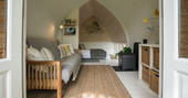 A view of the whole interior space with bedroom and living space, at Fleur's Retreat in Devon