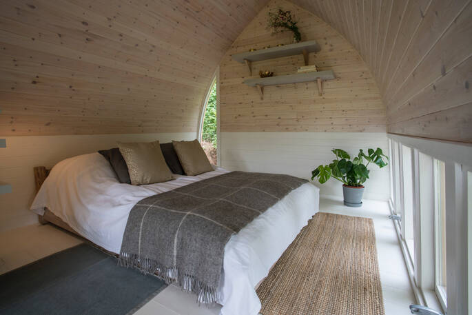 The simple but stylish interiors, with double bed at Fleur's Retreat in Devon