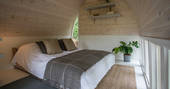 The simple but stylish interiors, with double bed at Fleur's Retreat in Devon