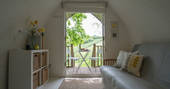 The warm living space with views of the hills at Fleur's Retreat in Devon
