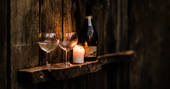 Enjoy a glass of fizz as you relax in the wood fired hot tub at Jackson's Cabin
