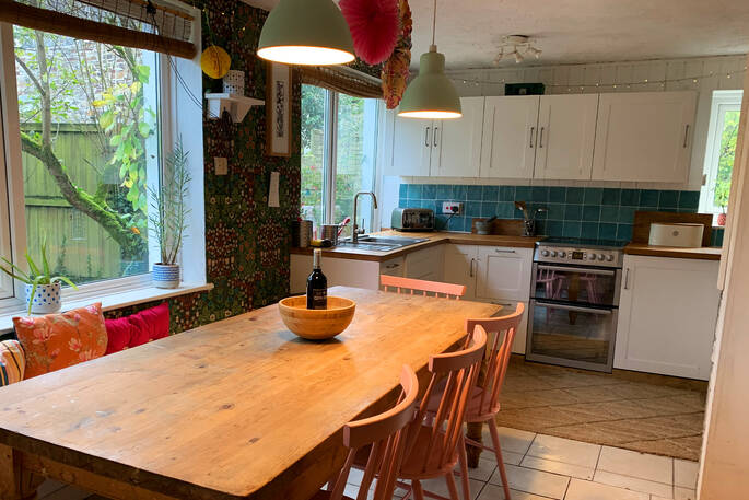 Kitchen equipped with an oven, hob, kettle, undercounter fridge