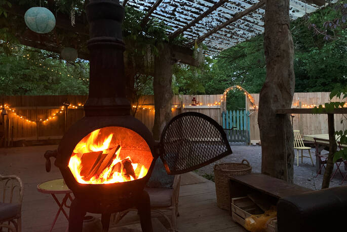 Relax by the wood burner in the covered living area