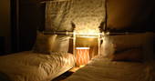 A set of warm twin beds at Taw safari tent in Devon