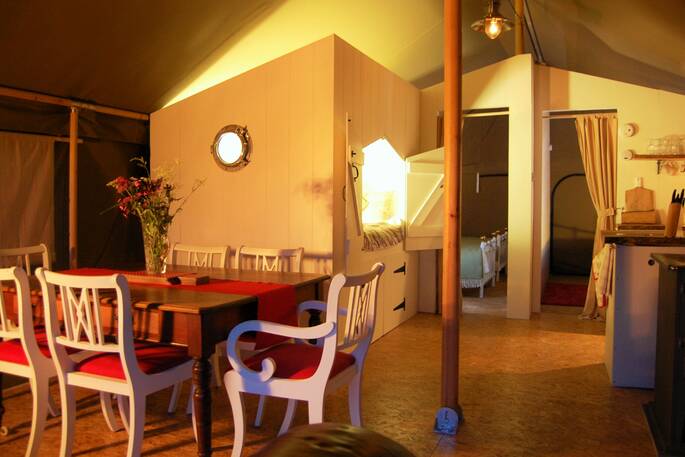 Interior of the dining area inside Torridge the safari tent at Welcombe Meadow 