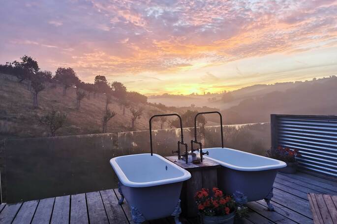 Take a soak in the double bath tubs and watch the sunset at The Old Piggery in Devon