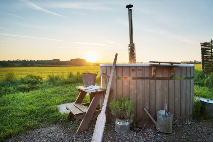 Heat up the hot tub and enjoy a soak whilst watching the sun set at The Happy Hare in Dorset
