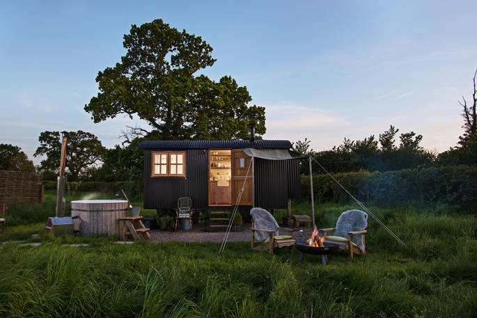 Light the fire pit, heat up the hot tub and relax outside The Happy Hare at Colber Farm in Dorset