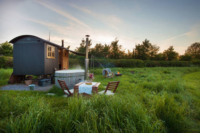 Light the fire pit, heat up the hot tub and relax outside The Happy Hare at Colber Farm in Dorset