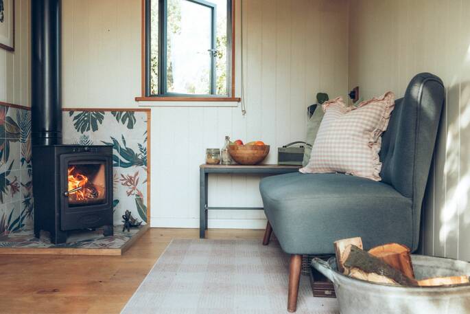 10 - Living area with sofa and wood burner