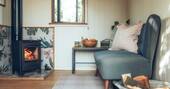 10 - Living area with sofa and wood burner