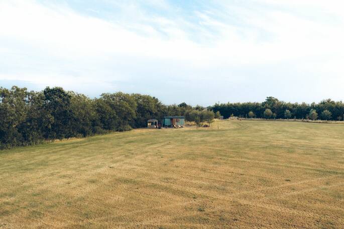 13 - Hut is located on the edge of a large field