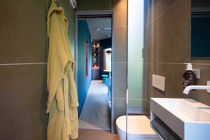 Bathroom with a hot tub, sink and flushing toilet