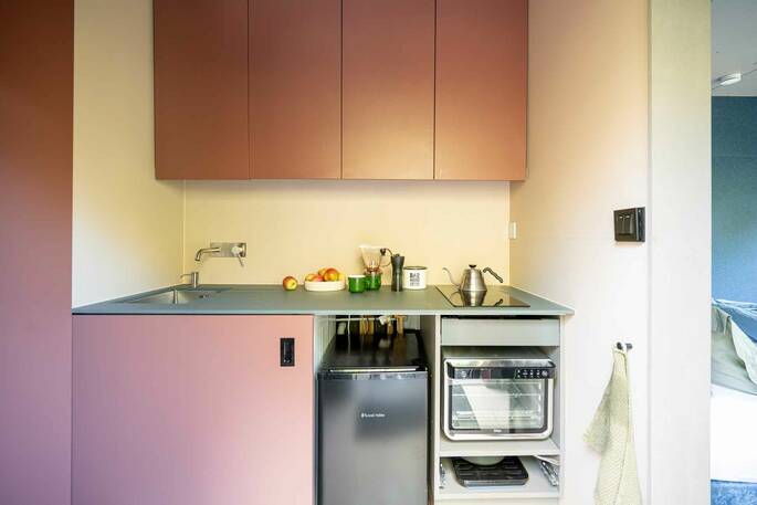 Kitchen equipped with an oven, hot, kettle and undercounter fridge