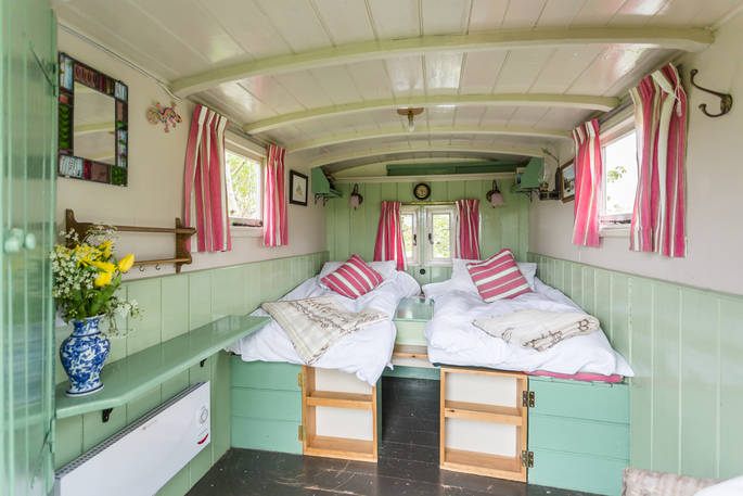 Interior of living van at Camping Coach, made up as two comfortable single beds, Dorset