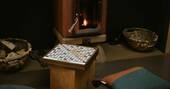 10 - sit by the wood burner play board games