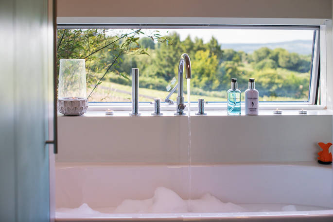 Red Kite cabin view from the bath tub at Red Kite Lodge in Shaftesbury, Dorset