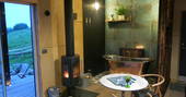 Silent Owl cabin copper bathtub and wood burner, Red Kite Lodge at Shaftesbury, Dorset