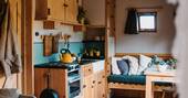 Kitchenette equipped with an oven two ring hob and cooking utensils