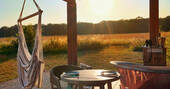 Outdoor bath tub showing path to cabin