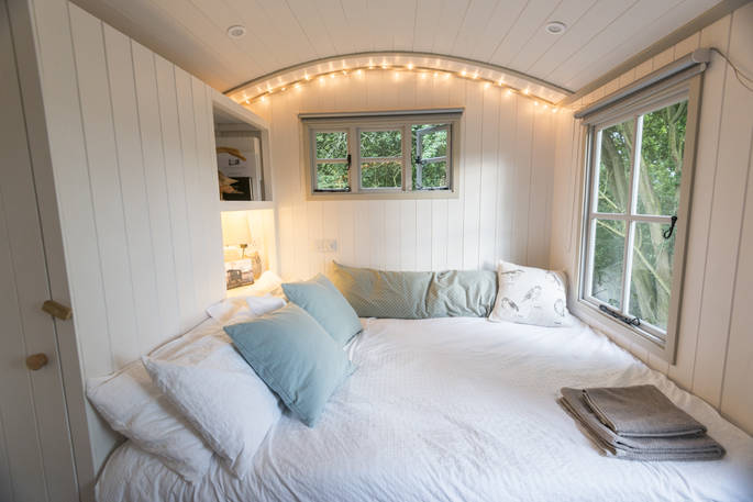 King-size bed inside Wigeon at The Shepherds Hide in Essex