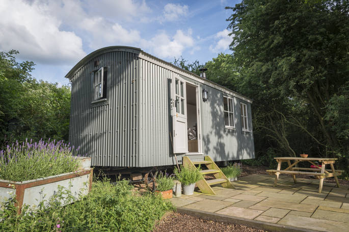 Sit outside on the decking of Wigeon at The Shepherds Hide in Essex