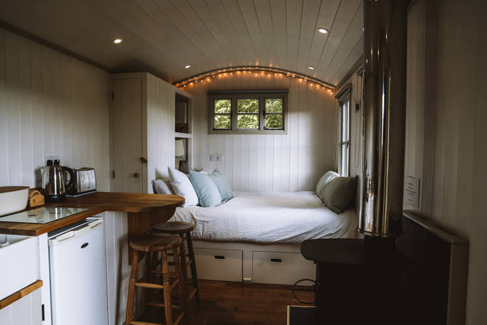 The cosy and warm interiors of Wigeon shepherd's hut in Essex