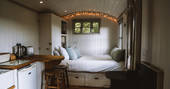 The cosy and warm interiors of Wigeon shepherd's hut in Essex