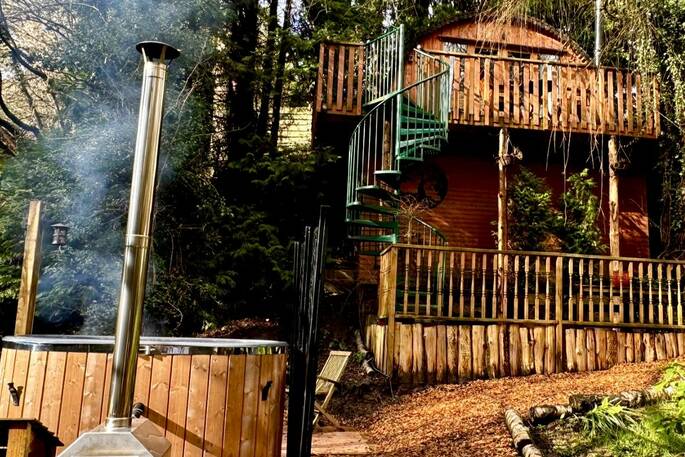 hot tub and treehouse landscape
