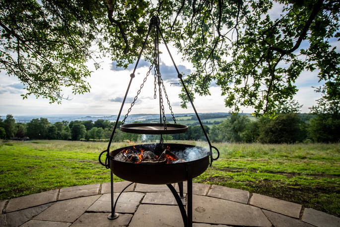 Light the fire pit outside of The Fuselage at Lypiatt Hill in Gloucestershire