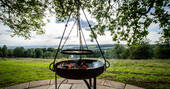 Light the fire pit outside of The Fuselage at Lypiatt Hill in Gloucestershire