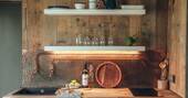 Kitchen equipped with induction hob, oven and cooking utensils