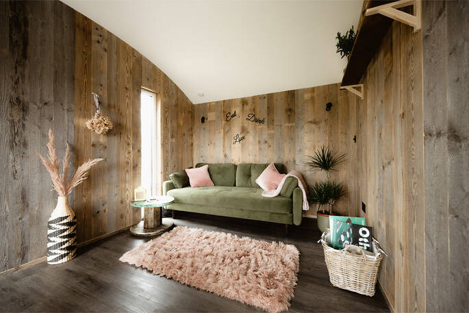 Lounge area with a sofa bed and board games