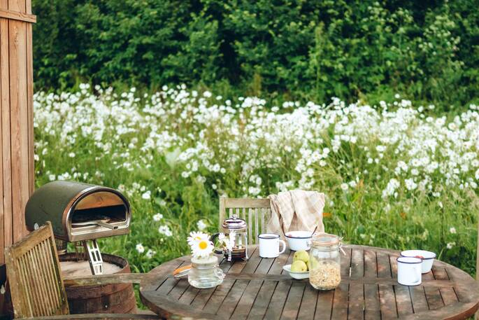 Outdoor dining area with pizza oven