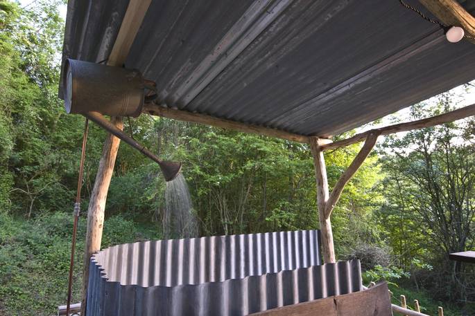Enjoy an outdoor bathing experience and the watering can outdoor shower at Gold Rush Cabin in Gloucestershire