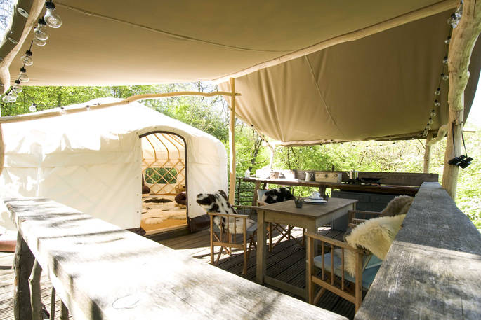 Exterior of Yurt Reynolds with decking for cooking and dining at Westley Farm 