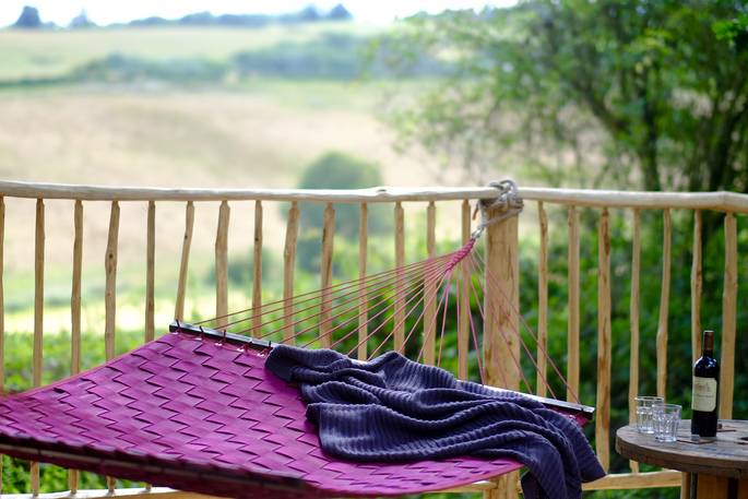 hammock and bottle of wine with scenic view