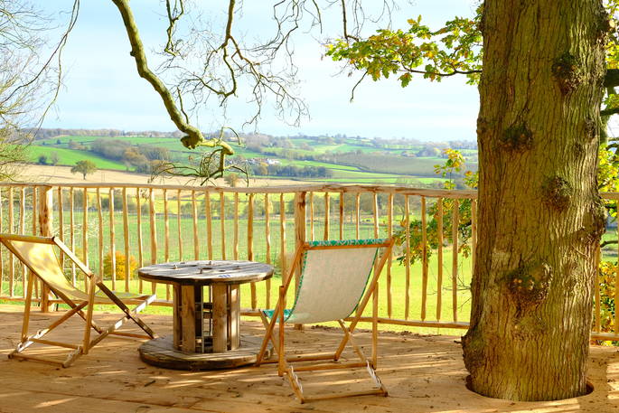 venn treecabin tree house holidays herefordshire england uk glamping decking with view of malvern hills